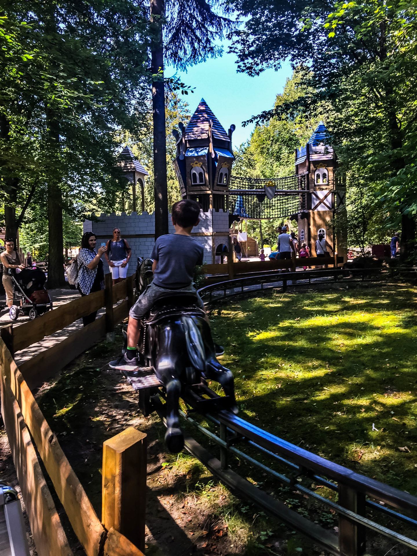 The little mechanical horse ride in the trees at Märchen-Paradies.