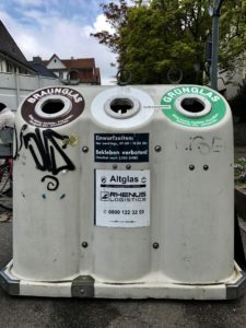 You have to walk to one of these, and then throw all your glass in, sorted by colour.