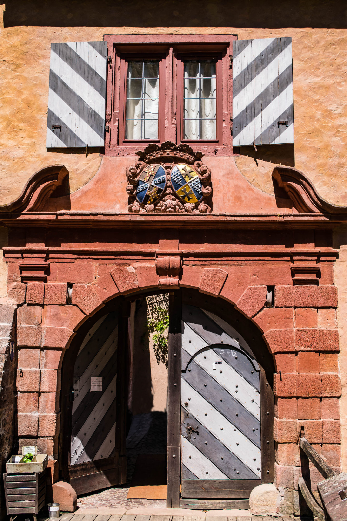 The doors to the Castle Mespelbrunn. You can see the little crate that holds the fish food on the lefthand side there. 
